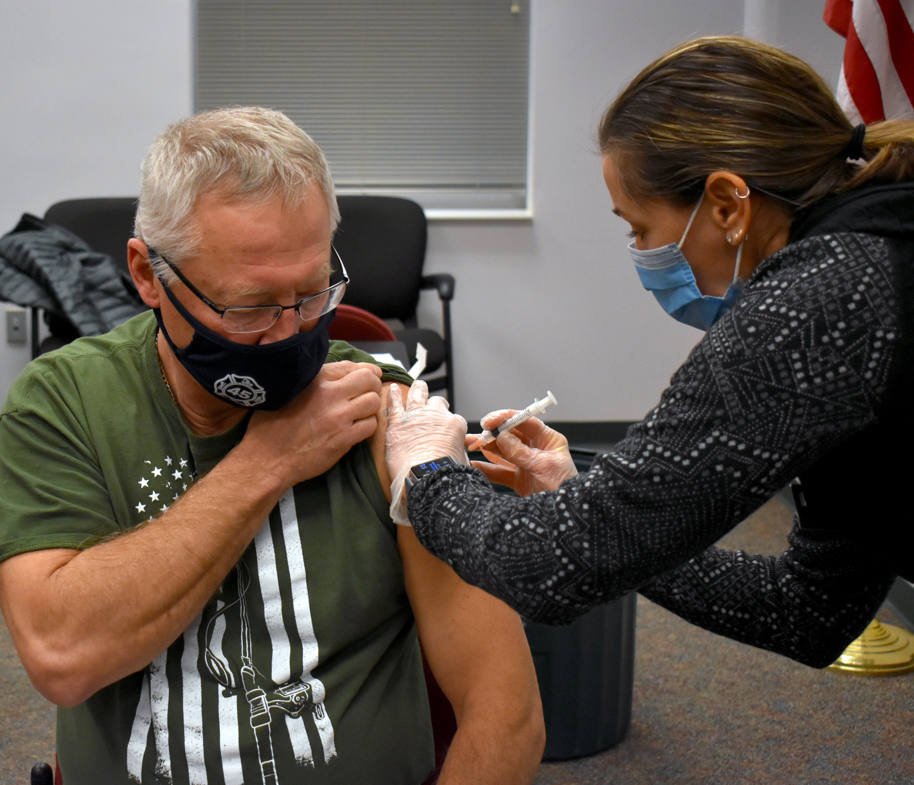 Quality Care Pharmacy administering the COVID-19 vaccine