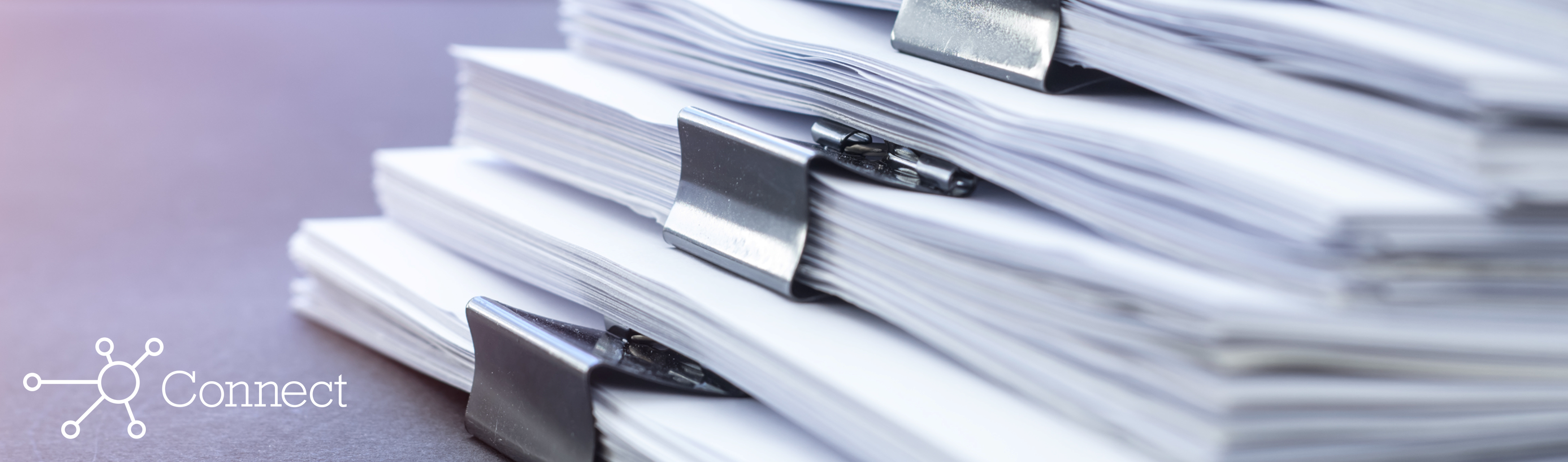 A stack of financial documents organized into packets with binder clips