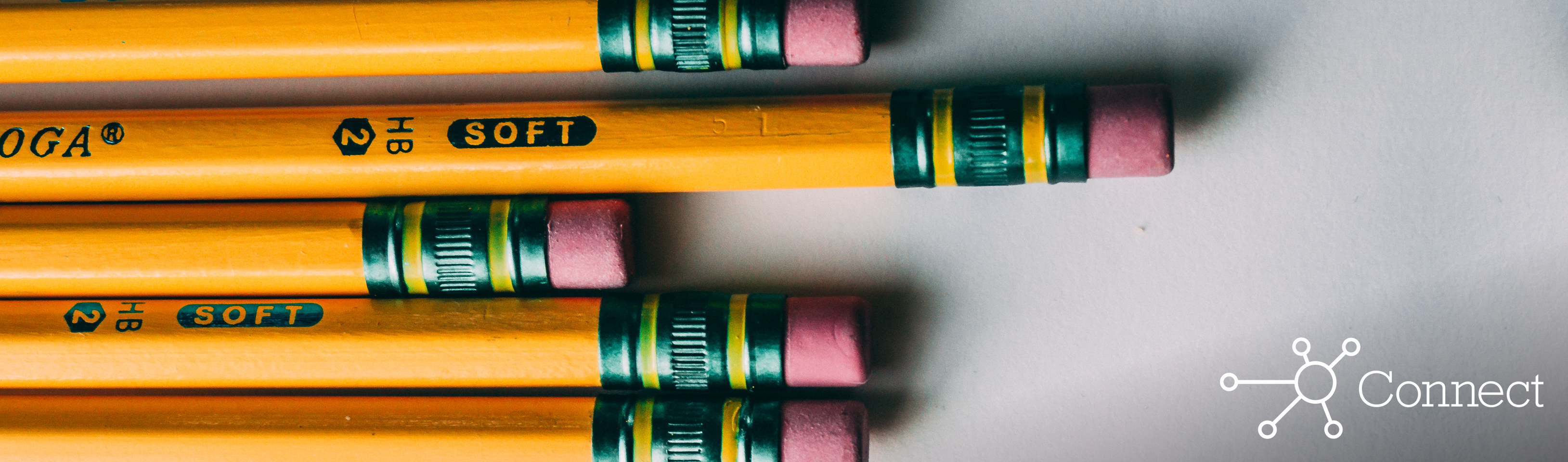Five pencils lined up side by side