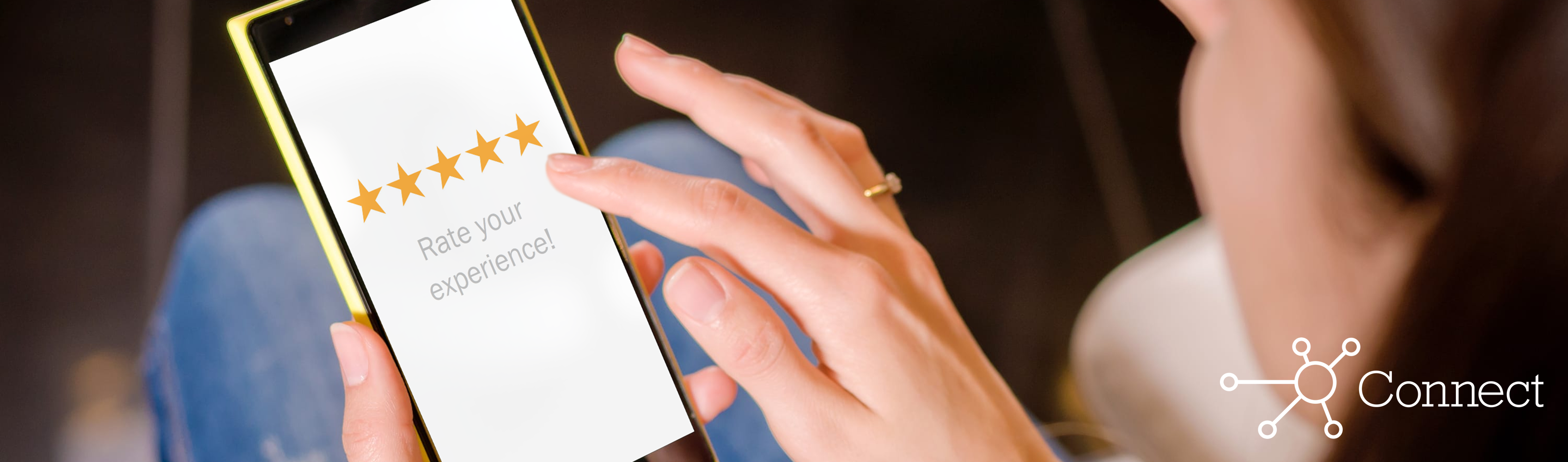 A woman giving a business a star rating on her phone